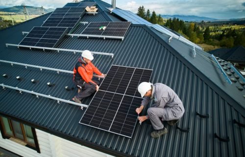 technicians-installing-photovoltaic-solar-panels-on-roof-of-house--e1696237312747.jpg